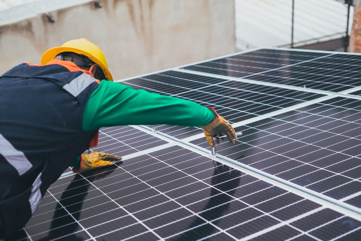 An accredited installer fitting solar panels