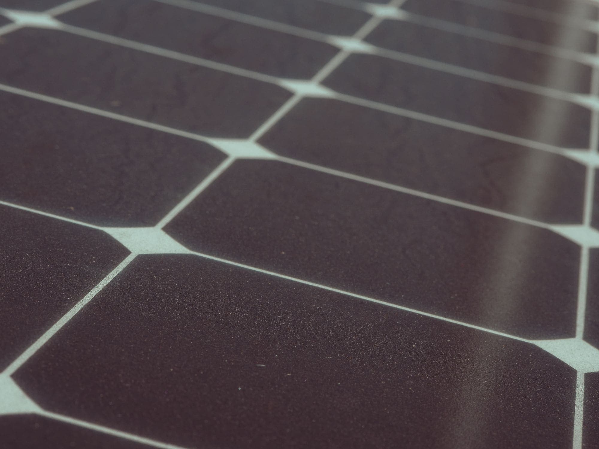 Close-up of a solar panel surface catching the light